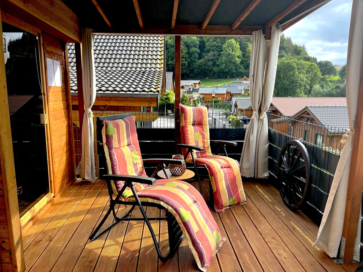 Free-standing timber sauna on the terrace of a holiday home by the Riedener Waldsee